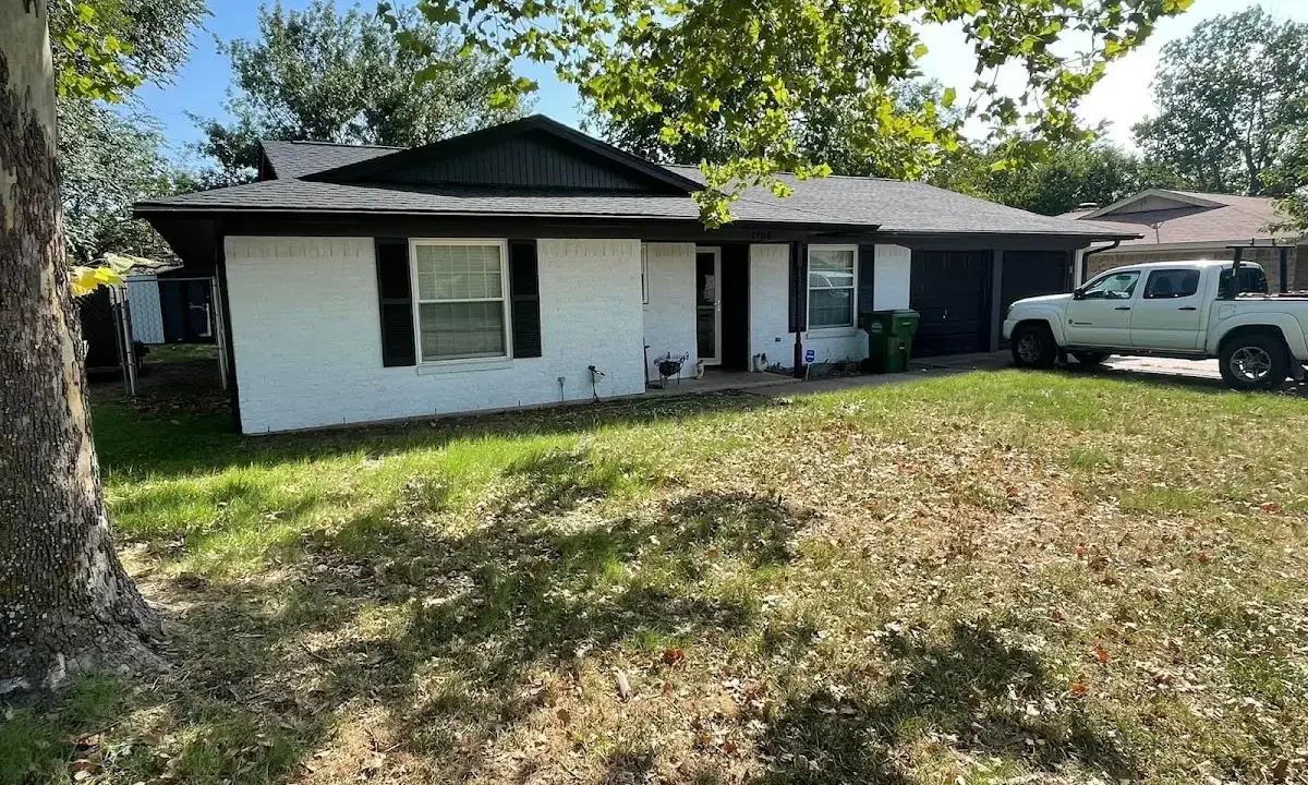 Professional roofing crew working on a residential roof in Christiansburg